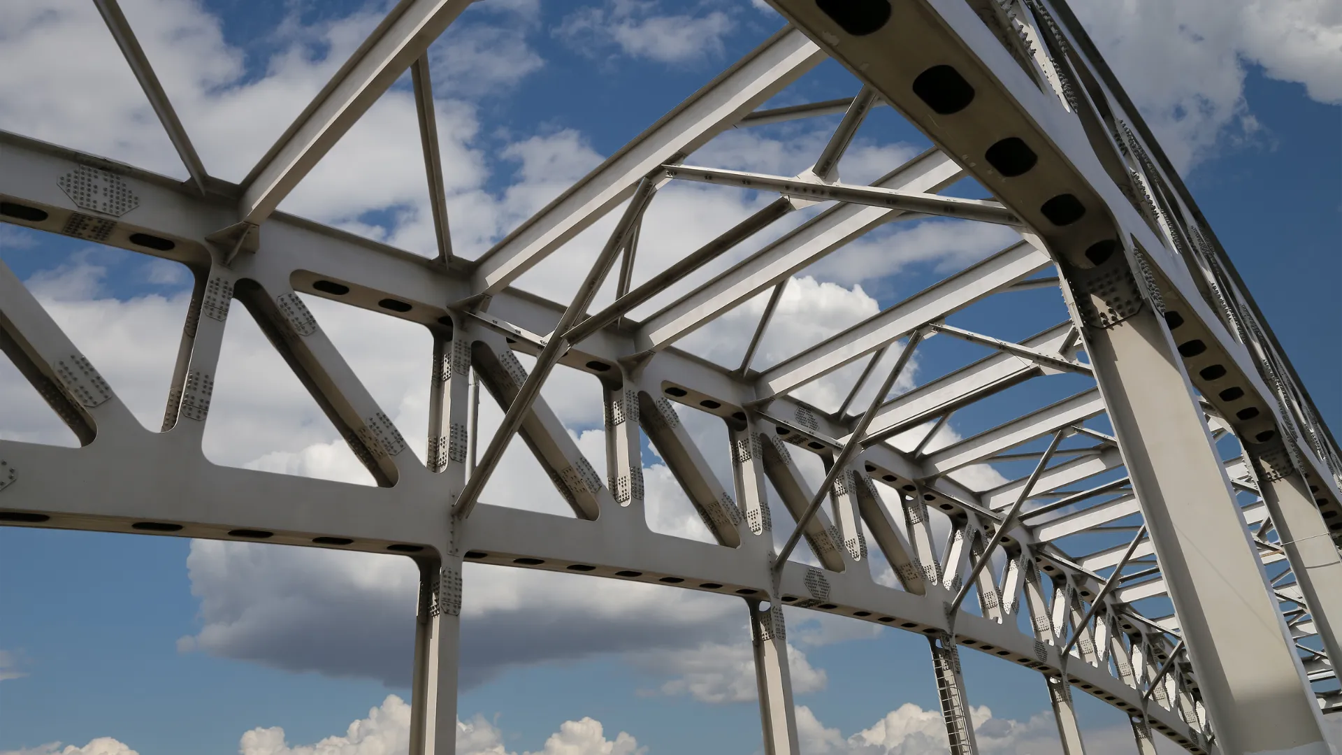 Welded steel frame of a bridge against the sky
